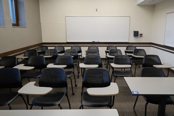 Back of room view of student tablet arm seating and double markerboard at rear of room