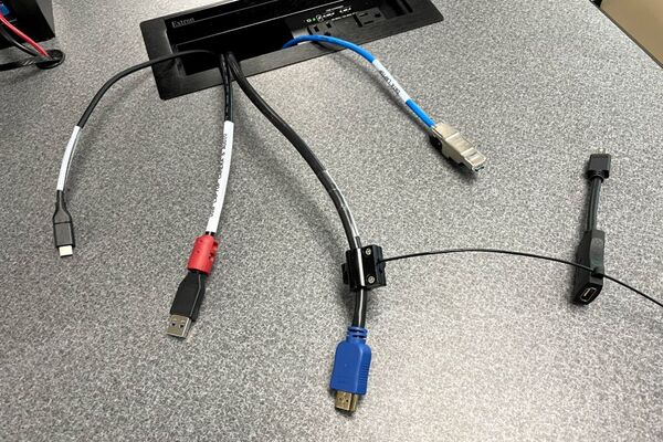 Pedestal - laptop cable connections with cables pulled out showing cable ends