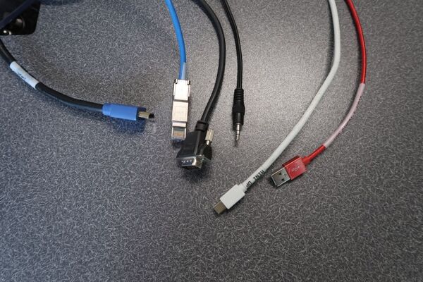 Pedestal - laptop cable connections with cables pulled out showing cable ends