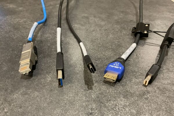 Pedestal - laptop cable connections with cables pulled out showing cable ends