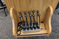 Assisted listening devices on pedestal shelf