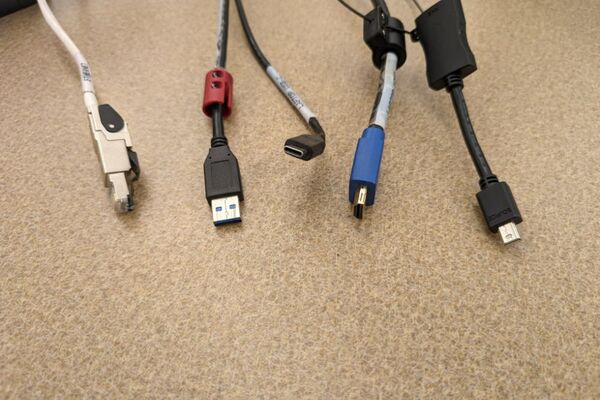 Pedestal - laptop cable connections with cables pulled out showing cable ends