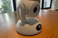 Camera mounted to a wall and instructor enabled adjustments to the lens to allow the instructor to be "seen" by the camera in more locations around the room