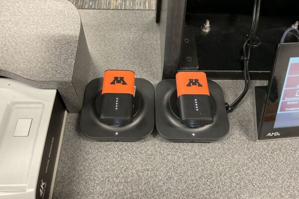 Pedestal surface- Two microphones in charging base