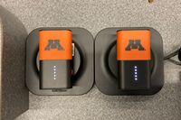 View of microphones in charging base on pedestal