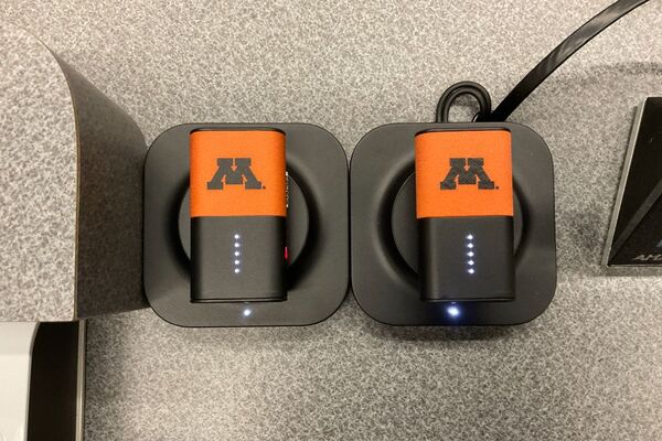 Microphones on top of instructor pedestal with charging base