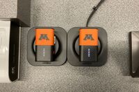 Wireless microphones in charging base on pedestal 