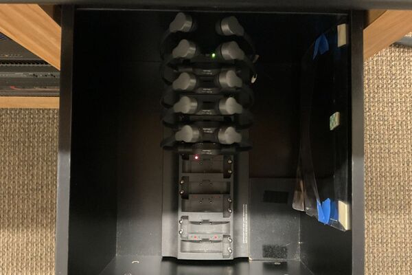 Assisted listening devices charging inside drawer