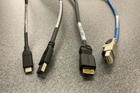 Pedestal - laptop cable connections with cables pulled out showing cable ends