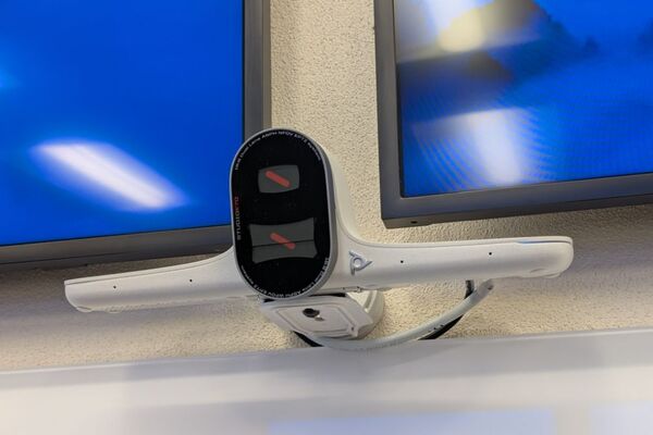 Camera and instructor enabled adjustments to the lens to allow the instructor to be "seen" by the camera in more locations around the room