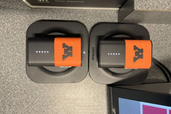 Pedestal - view showing two wireless mics in charging base 