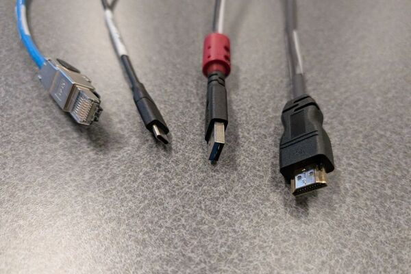 Pedestal - laptop cable connections with cables pulled out showing cable ends