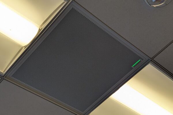 White 2x2 tile mounted in the ceiling to provide microphone coverage over student seating