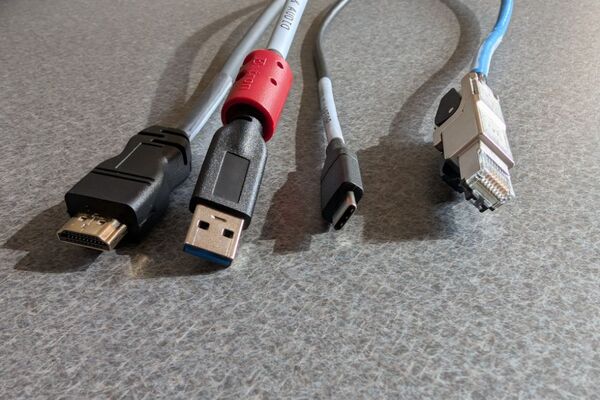 Pedestal - laptop cable connections with cables pulled out showing cable ends