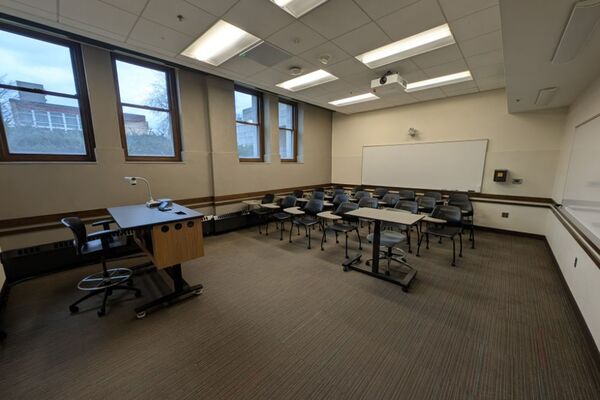 Back of room view of student tablet arm seating and double markerboard at rear of room