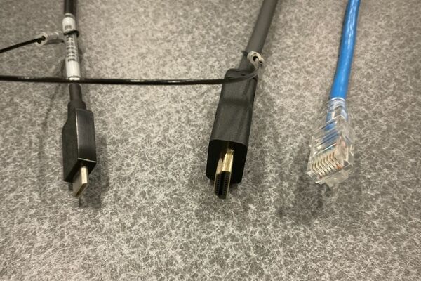 Pedestal - laptop cable connections with cables pulled out showing cable ends