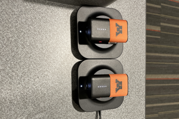 Pedestal - top of pedestal showing two wireless mics in charging base 