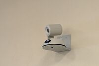 Camera mounted to a wall and instructor enabled adjustments to the lens to allow the instructor to be "seen" by the camera in more locations around the room