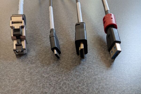 Pedestal - laptop cable connections with cables pulled out showing cable ends