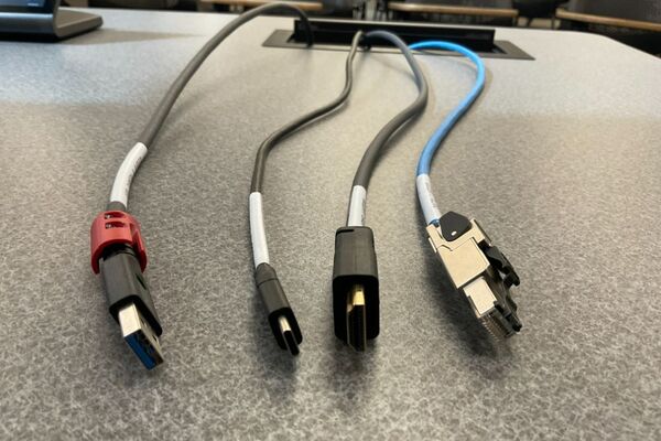 Pedestal - laptop cable connections with cables pulled out showing cable ends