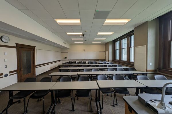 Back of room view of tables and chairs