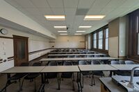 Back of room view of tables and chairs