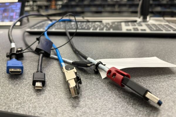Pedestal - laptop cable connections with cables pulled out showing cable ends