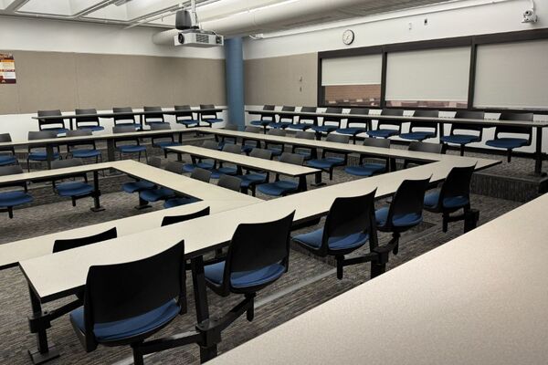 Back of room view of student fixed-table and chair seating
