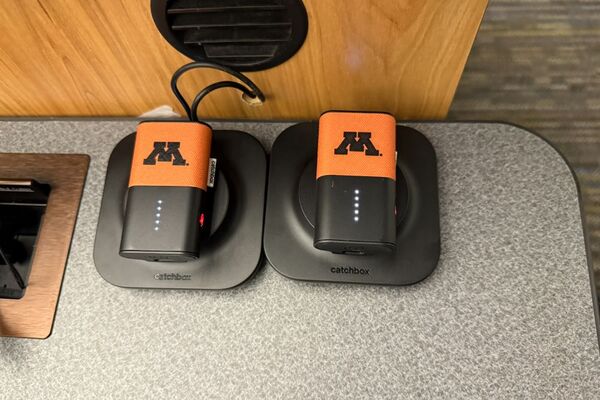 View of two wireless mics in charging base