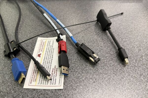 Pedestal - laptop cable connections with cables pulled out showing cable ends
