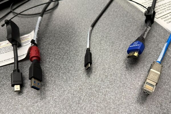 Pedestal - laptop cable connections with cables pulled out showing cable ends