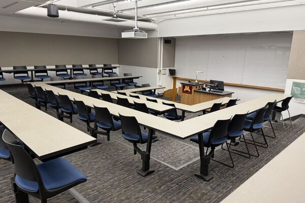 Front of room view with lectern center in front of markerboard
