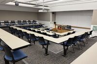 Front of room view with lectern center in front of markerboard
