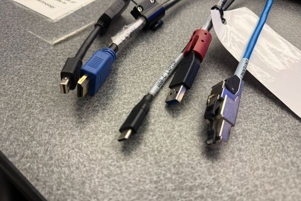 Pedestal - laptop cable connections with cables pulled out showing cable ends