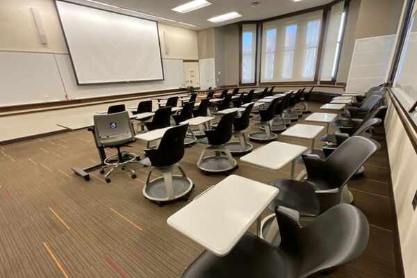 Front of room view with lectern on right in front of markerboard 