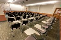  Front of room view with lectern on left in front of markerboard