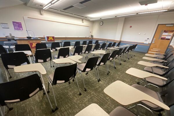 Front of room view with lectern on left in front of markerboard 