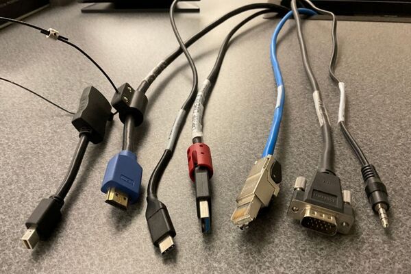 Pedestal - laptop cable connections with cables pulled out showing cable ends