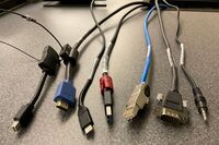 Pedestal - laptop cable connections with cables pulled out showing cable ends