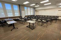 Back of room view of tables and chairs