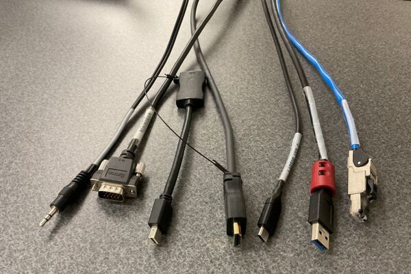 Pedestal - laptop cable connections with cables pulled out showing cable ends