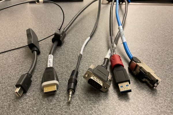 Pedestal - laptop cable connections with cables pulled out showing cable ends