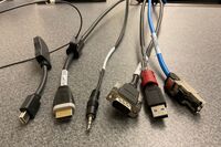 Pedestal - laptop cable connections with cables pulled out showing cable ends