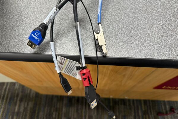 Pedestal - laptop cable connections with cables pulled out showing cable ends