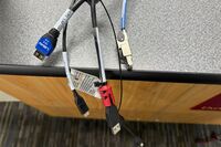 Pedestal - laptop cable connections with cables pulled out showing cable ends