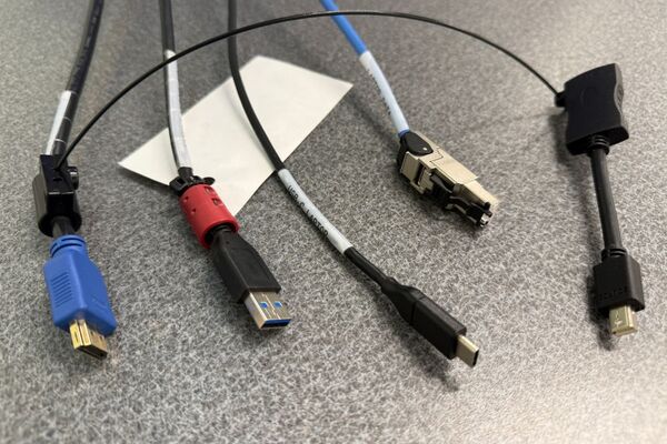 Pedestal - laptop cable connections with cables pulled out showing cable ends