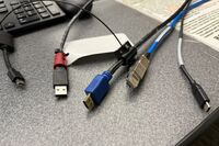 Pedestal - laptop cable connections with cables pulled out showing cable ends
