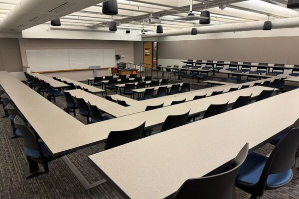 Front of room view with lectern center in front of markerboard 