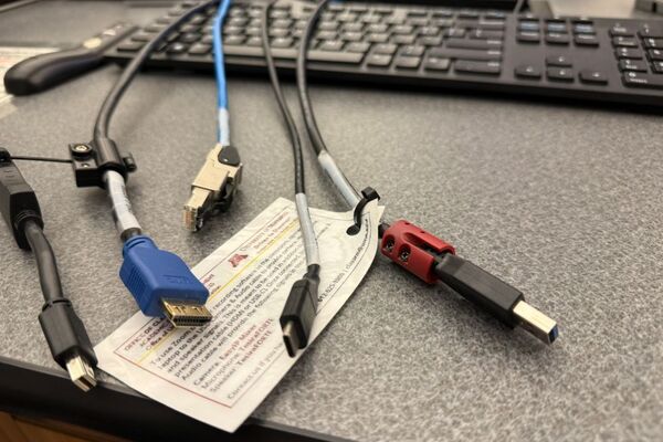 Pedestal - laptop cable connections with cables pulled out showing cable ends