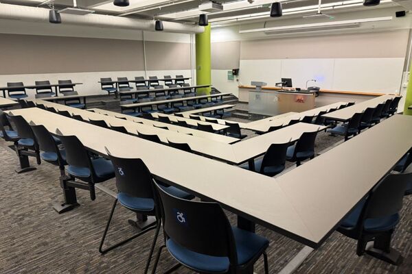 Front of room view with lectern center in front of markerboard 